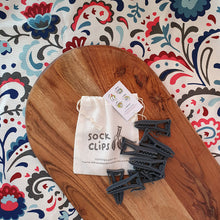 Load image into Gallery viewer, Sockclips keeping socks together in the wash 10 pack grey clips on wooden board
