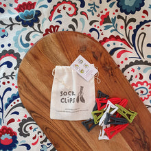 Load image into Gallery viewer, Sockclips keeping socks together in the wash 10 pack multicolour clips on wooden board